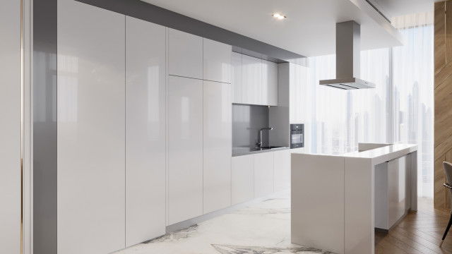 This picture shows a modern bedroom designed by Antonovich Design. The room features a large, king-sized bed with a white velvet headboard and luxurious gray and gold accents. The walls are painted a soft gray shade, with white moldings providing a clean and sophisticated accent. The room is finished off with a beautiful glass chandelier hanging above the bed and two minimalist nightstands on either side.