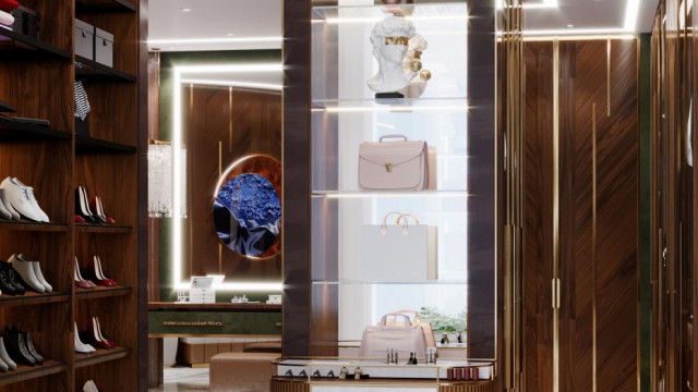 Luxurious interior featuring an ornate chandelier, upholstered furniture, and a plush, patterned rug.