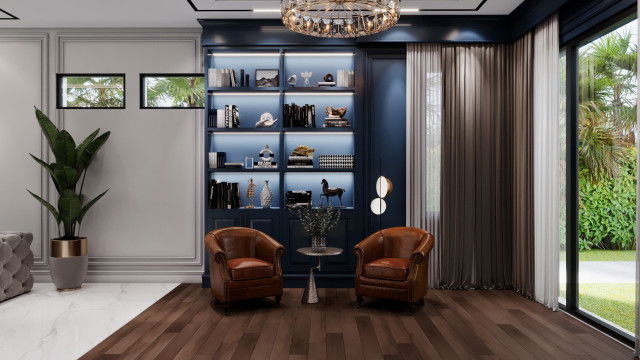 This picture is of a luxurious contemporary style living room designed by Antonovich Design. The room features sleek lines, luxurious beige and cream furnishings, and modern artwork on the walls. The room is brightly lit by recessed lighting and there is a large sofa in the center with two armchairs facing it. On the left side of the room is an accent chair and ottoman, along with a side table and coffee table. The polished wooden flooring creates a perfect backdrop for the neutral colored furniture. Overall, this room provides an inviting and elegant atmosphere.