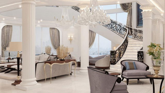 Modern luxury living room with ornate furniture upholstered in beige fabric and an intricately patterned area rug.