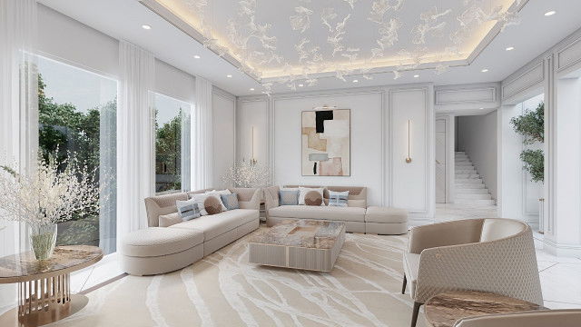 An ornately decorated, luxuriously furnished interior space with taupe walls, white crown molding, and architectural details in white, gold, and beige tones.