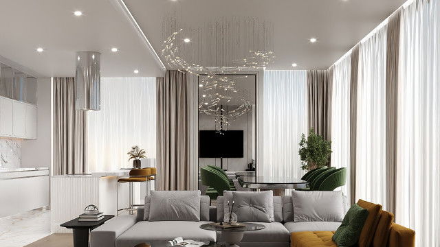 A modern kitchen with a high-end kitchen island, featuring built-in cabinet storage, a cooktop, sink, and stone countertop.