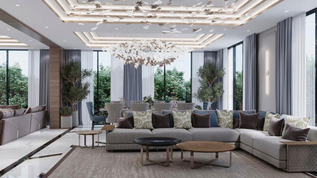 Vibrant modern interior with high-quality furnishings, including sofa, armchairs and coffee table. Feature wall with abstract art.