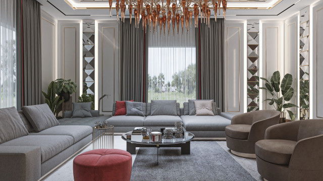 A modern living room featuring a bright white and gold colour palette, high-hung curtains, a luxurious velvet couch and an ornate, contemporary chandelier.