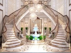 This picture shows a shopping bag with the logo of a company labeled "Made with Love". The bag appears to be crafted out of white paper and has decorative hearts printed on it. There is also a handle at the top making it easy to carry.