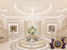 This picture shows a group of people standing in a circle, with their hands joined together. The people appear to be smiling and laughing, suggesting that the group is enjoying some kind of event or celebration.