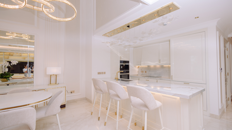 All-white kitchen with breakfast bar